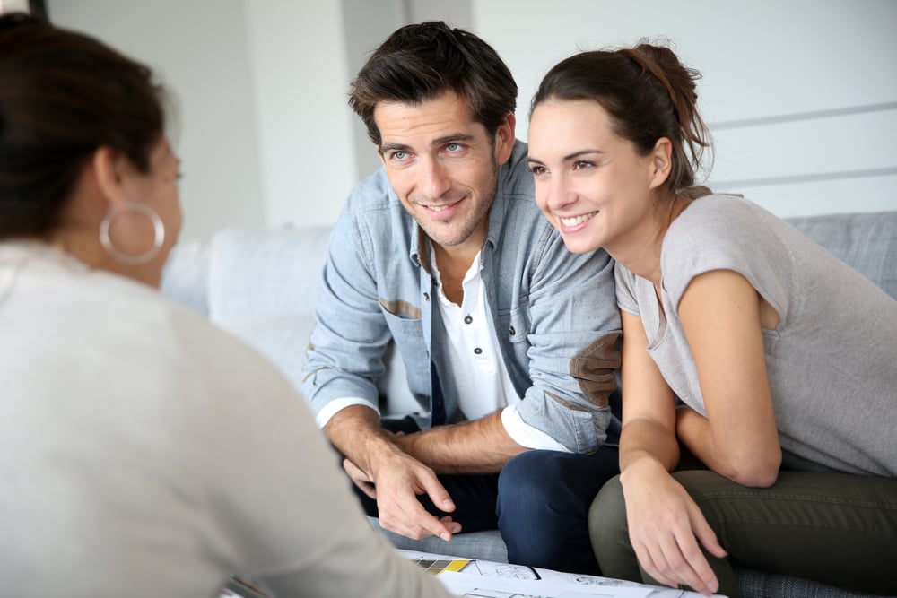 Couple meeting architect for house construction